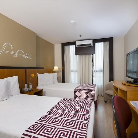 Comfort Hotel Тагуатинга Стая снимка